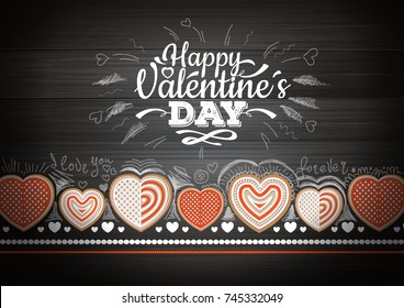 Top view of valentine cookies on wooden background. Happy Valentine`s Day