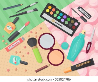 Top view of various makeup decorative cosmetics products on colorful patterns background.