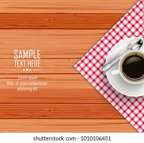 Top view of white coffee cup and a saucer on wooden table
