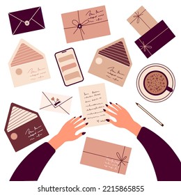 Top view of a woman's hands reading a letter and envelopes in beige color