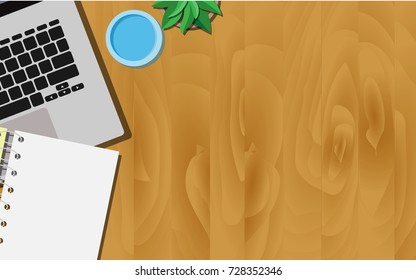 Top View Of Wooden Working Desk With Laptop, A Glass Of Water, And Empty Paper Note With Copy Space For Your Own Text