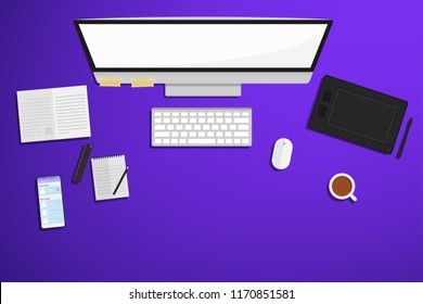 Top view of work space with computer ,phone notebook and cup of coffee.