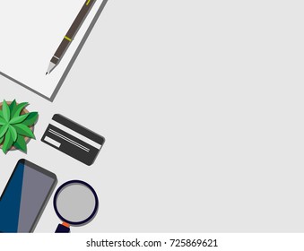 Top view of working desk with credit card, mobile phone, and empty paper note with copy space for your own text