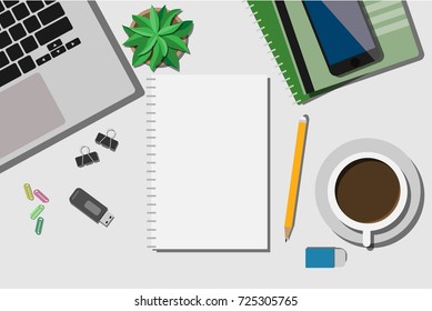 Top view of working desk with laptop, mobile phone, and empty paper note with copy space for your own text