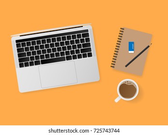 Top view working desk with laptop computer, notebook, pencil and a cup of coffee isolated on orange background