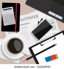 Top view of working place with elements on wooden table background pencil, eraser, smartphone, calculator, envelope, cup of coffee newspaper and laptop. Workplace
