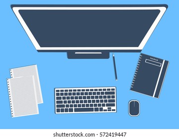 Top view of working place elements over table with computer