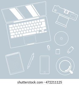 Top view of workplace and accessories on table, gray.