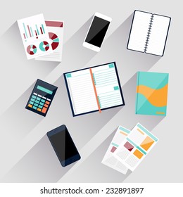 Top view of workplace with calculator, smartphone, stationery and documents