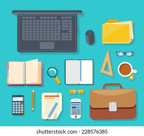 Top view of workplace with laptop, briefcase, calculator, smartphone, stationery and documents