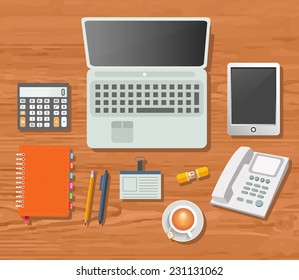 Top view of workplace with notebook, tablet, smartphone, office items and devices on pink background
