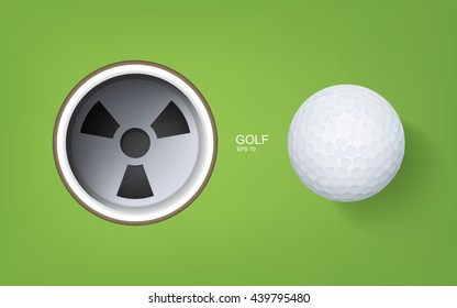 Top views of golf hole and golf ball on green background.