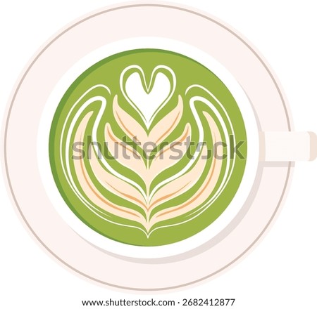 Top-down view of a cup of matcha latte with a heart and floral design in the foam, sitting on a white saucer.