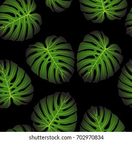 Topical palm leaves over black, seamless pattern. Vector illustration.