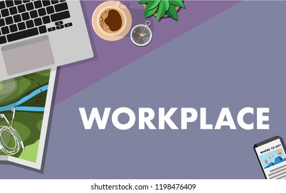Topview of the table with laptop, map,coffee,mobile phone,headphone,compass,small tree in the pot,with copy space for text WORKPLACE
