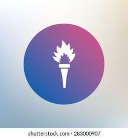 Torch flame sign icon. Fire flaming symbol. Icon on blurred background. Vector