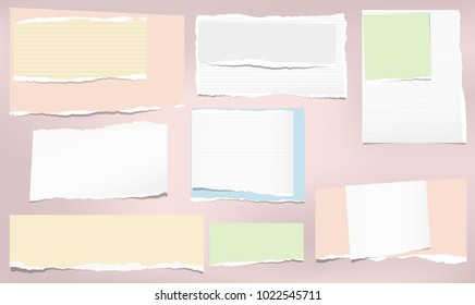 Torn colorful and white note, notebook paper strips stuck on pink background