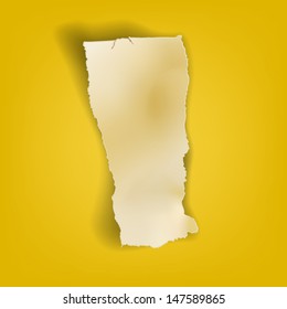 torn piece of old paper yellow background page ripped cardboard used for message