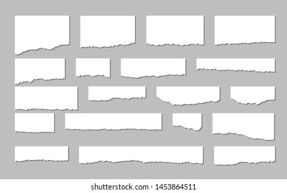 Torn sheets of paper. A set of torn paper and strips of paper on a dark background. Vector illustration.