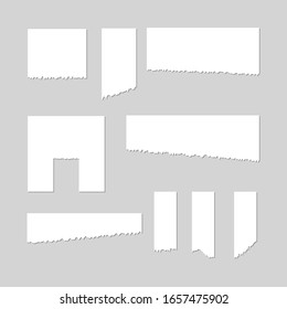Torn sheets of paper. A set of torn paper and strips of paper on a dark background. Vector illustration.