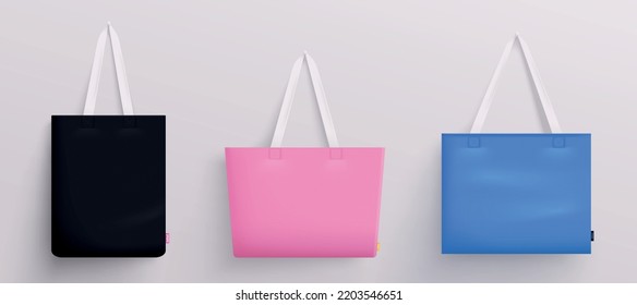 Tote fabric bag mockup realistic set of three hanging bags with white handles and colored bottom vector illustration