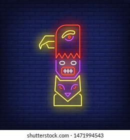 Totem pole with eagle and owl neon sign. Culture, idol, religion design. Night bright neon sign, colorful billboard, light banner. Vector illustration in neon style.
