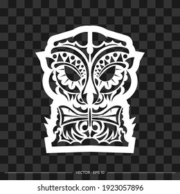 Totem in the shape of a face made of patterns. The contour of the face or mask of a warrior. For T-shirts and prints. Vector illustration.