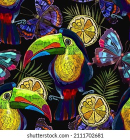 Toucan birds, tropical butterflies, lemon slice and palm leaves seamless pattern. Embroidery art. Jungle paradise background. Fashionable template for design of clothes, textiles