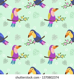Toucans bird on branch seamless pattern fabric textile wallpaper.