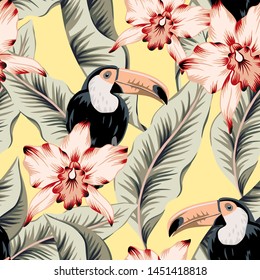 Toucans, pink orchid flowers, banana palm leaves, yellow background. Vector floral seamless pattern. Tropical illustration. Exotic plants, birds. Summer beach design. Paradise nature