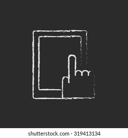 Touch screen tablet hand drawn in chalk on a blackboard vector white icon isolated on a black background.