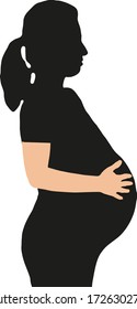 touching her pregnant belly with her hands
