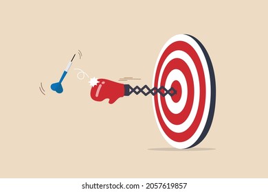 Tough time or career struggle, trouble, difficulty or obstacle to achieve business target, hard situation to losing competition, boxing glove come out of dartboard bullseye to punch dart from target.