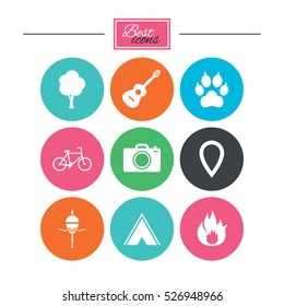 Tourism, camping icons. Fishing, fire and bike signs. Guitar music, photo camera and paw with clutches. Colorful flat buttons with icons. Vector