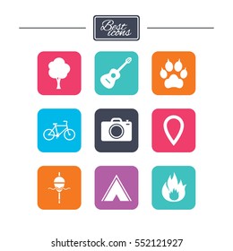 Tourism, camping icons. Fishing, fire and bike signs. Guitar music, photo camera and paw with clutches. Colorful flat square buttons with icons. Vector