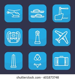 tourism icon. Set of 9 outline tourism icons such as helicopter, lighthouse, monument, backpack, flip flops, swimsuit, suitcase