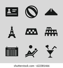 Tourism icons set. set of 9 tourism filled icons such as taxi, passport, arrival table, Chichen Itza, Coliseum, Eiffel Tower, cocktail, man laying in the sun