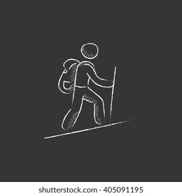 Tourist backpacker. Drawn in chalk icon.