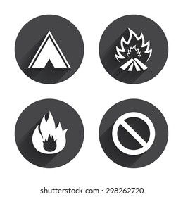 Tourist camping tent icon. Fire flame and stop prohibition sign symbols. Circles buttons with long flat shadow. Vector