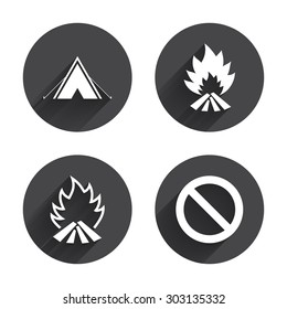 Tourist camping tent icon. Fire flame and stop prohibition sign symbols. Circles buttons with long flat shadow. Vector