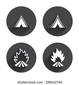 Tourist camping tent icons. Fire flame sign symbols. Circles buttons with long flat shadow. Vector