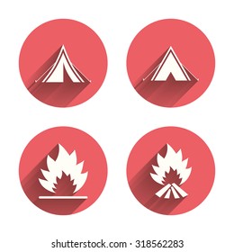 Tourist camping tent icons. Fire flame sign symbols. Pink circles flat buttons with shadow. Vector