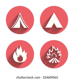 Tourist camping tent icons. Fire flame sign symbols. Pink circles flat buttons with shadow. Vector