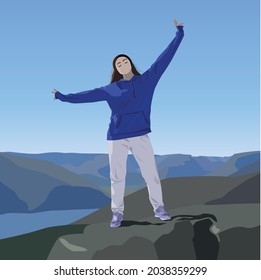 A tourist is enjoying the moment on the top of the mountain with his hands up. Conquest of the summit. Girl in loose blue hoodie on the background of a beautiful landscape of mountains.