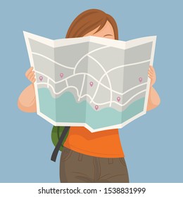 Tourist girl with map in the city