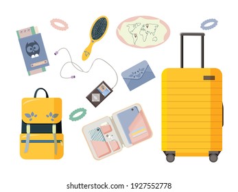 Tourist items isolated on white background. Suitcase on wheels, backpack, wallet, player, headphones, passport with plane tickets, organizer with tablet, phone, comb and hair bands