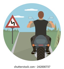 Tourist rides a motorcycle on the forest road