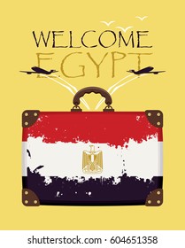 Tourist suitcase with the flag of Egypt and passenger planes