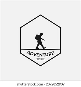 tourist walking towards the top of the mountain, travel and expedition logo template