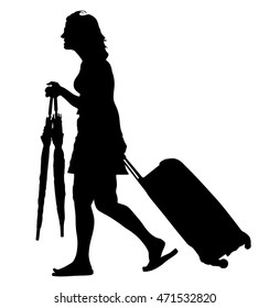 Tourist woman traveler carrying his rolling suitcase, and hold umbrellas vector silhouette illustration isolated on white background. Passenger girl walking with luggage. Person with load waiting taxi